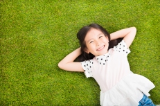 Girl Smiling Grass.jpg